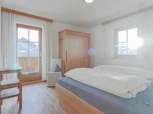 a bedroom with two beds and a window at Igl Hof Top 3 in Westendorf