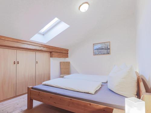a bedroom with a bed with a blue mattress at Igl Hof Top 4 in Westendorf