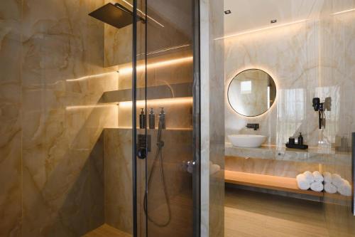 a bathroom with a shower and a sink at Villa Lavender by Villa Plus in Kolymbia