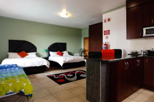 Postel nebo postele na pokoji v ubytování Grand View B&B