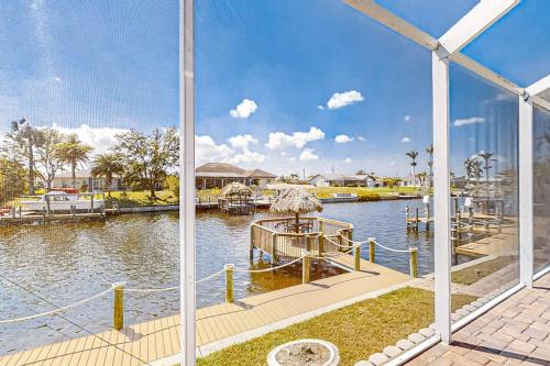 a view of a marina with a dock in the water at Waterfront Hideaway in Cape Coral