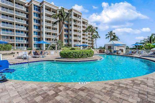 a swimming pool in front of a resort at Marco Beach Ocean Resort 801 in Marco Island