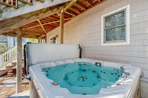 a hot tub in the back of a house at Rehoboth Beach --- 21163 Bayview Rd. in Dewey Beach