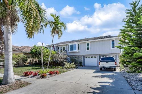a white van parked in front of a house at Madagascar Palm in Marco Island