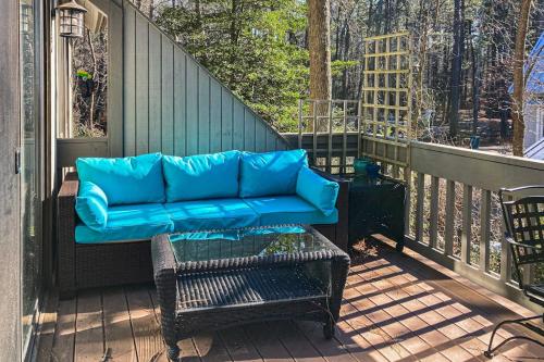 a blue couch on a balcony with a table at Sea Colony --- 2403 Round Robin in Bethany Beach