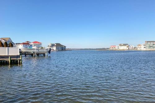 a large body of water with houses and a dock at Edgewater Acres --- 38874 Old Lighthouse Rd in Selbyville