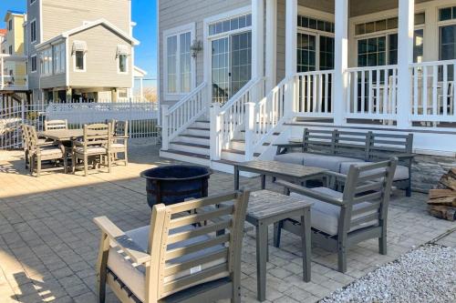 a patio with a table and chairs on a house at Edgewater Acres --- 38874 Old Lighthouse Rd in Selbyville