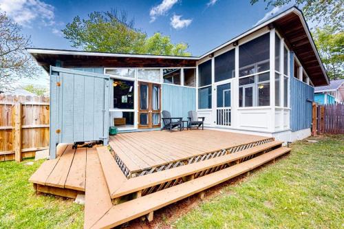 a house with a wooden deck in the yard at Ann Acres 21039 Elizabeth Ave in Rehoboth Beach