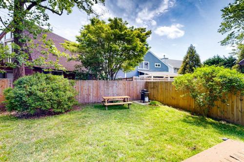 a backyard with a wooden fence and a bench at Ann Acres 21039 Elizabeth Ave in Rehoboth Beach