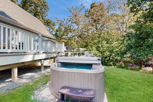 a hot tub sitting on the side of a house at Rehoboth Beach --- 18 Sabrina Dr in Lewes