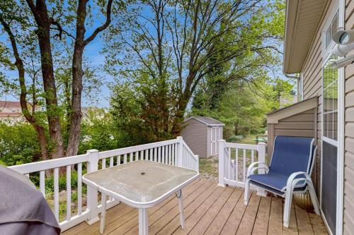 a patio with a table and a chair on a deck at South Hampton --- 33549 Water Mill Ln in Ocean View