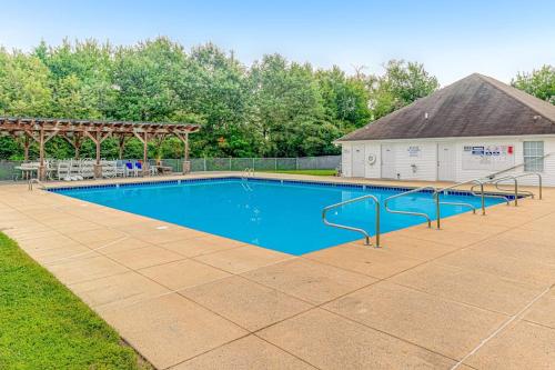 a large swimming pool with a gazebo at South Hampton --- 33549 Water Mill Ln in Ocean View