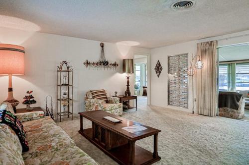 a living room with a couch and a table at Tarpon Lagoon in Port Charlotte