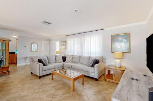 a living room with a couch and a coffee table at Seaside Serenity in Punta Gorda
