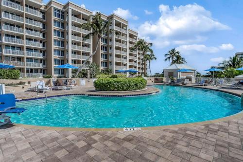 a pool in front of a large apartment building at Marco Beach Ocean Resort 807 in Marco Island