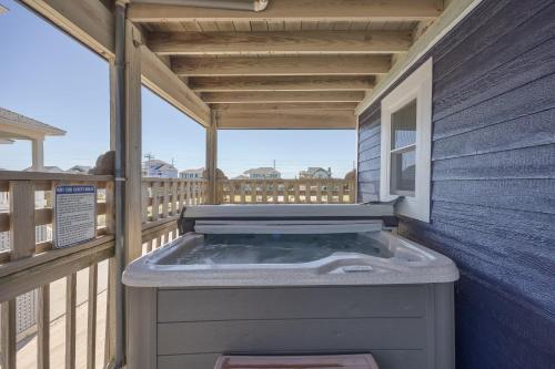 a hot tub on the deck of a house at 7674 - The Sweet Escape in Avon