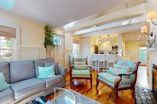 a living room with a couch and two chairs at Seaside Sanctuary in Harwich