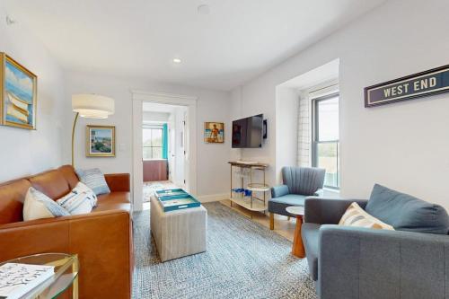 a living room with a couch and a table at Fun in the Sun in Provincetown