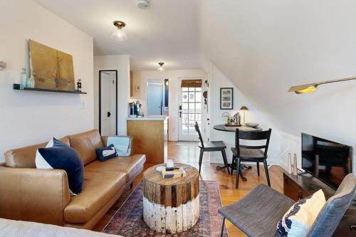 a living room with a couch and a table at The Buoy Room in Provincetown