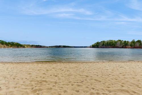 a sandy beach with a body of water at Sheep Pond Bow House in Brewster