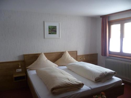 En eller flere senger på et rom på Hotel Gasthof Straub