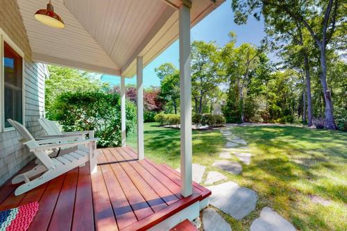 a porch with a bench on a house at Cape River Retreat in Centerville