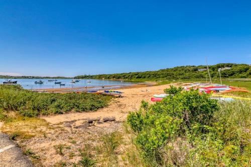 a sandy beach with boats in the water at Beachroad Hideout in Lobsterville