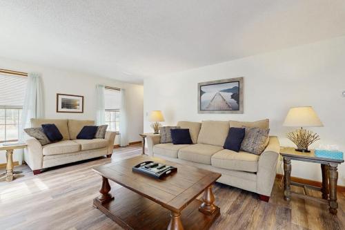 a living room with two couches and a coffee table at Fallen Oak Retreat in Oak Bluffs
