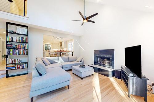 a living room with a couch and a fireplace at Tiffany's Treasure in Oak Bluffs