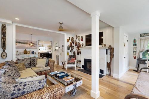 a living room with a couch and a fireplace at Sankofa House in Oak Bluffs