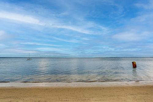 a person standing in the water at the beach at Bayview Bliss in Provincetown