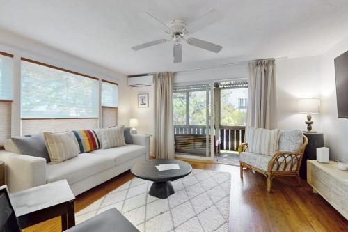 a living room with a couch and a table at Endless Summer in Provincetown