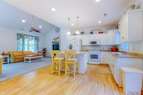 a kitchen with white cabinets and a table and chairs at Seaward Seahawk 9429 in Berlin