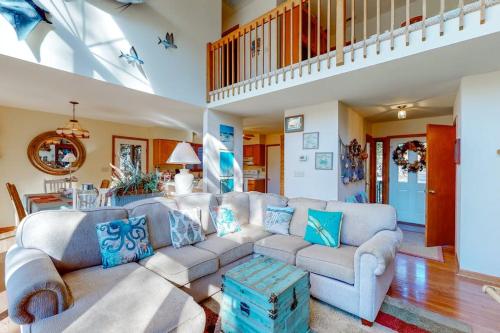a living room with a couch and a table at Dove Lane 8 in Ocean Pines