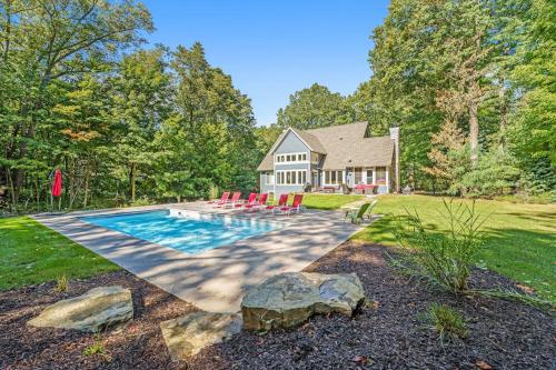 a house with a swimming pool in the yard at Thunder Road in Fennville