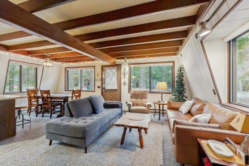 a living room with a couch and a table at Crystal Chalet in Thompsonville