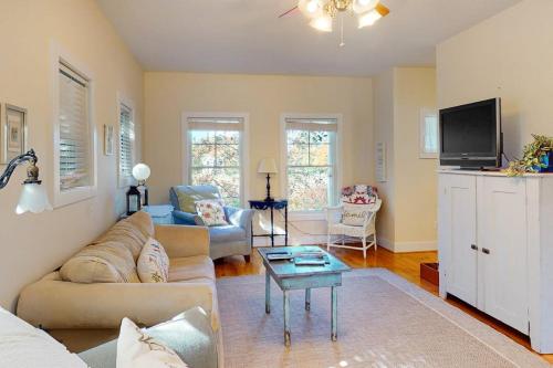 a living room with a couch and a tv at Green Glen in Empire