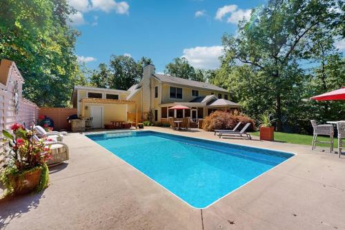 a swimming pool in the backyard of a house at Grand Getaway in Grand Beach