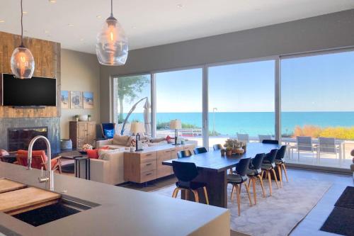 a kitchen and living room with a view of the ocean at Leisure On The Lake in New Buffalo