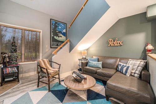 a living room with a couch and a table at Wintergreen Condo, Unit #543 in Thompsonville