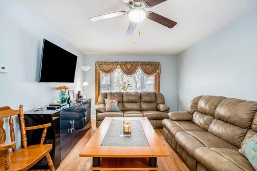 a living room with a couch and a table at South Haven Heaven in South Haven