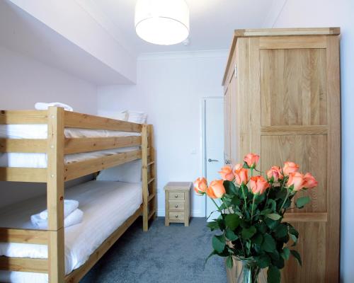 Ένα ή περισσότερα κρεβάτια σε δωμάτιο στο Austens Apartments