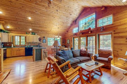 a living room with a couch and a table at Ridge Wood in Empire