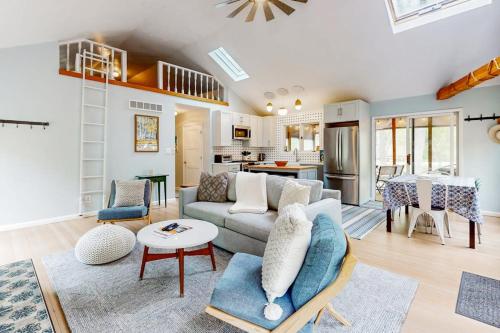 a living room with a couch and a table at Livywood Cottage in New Buffalo