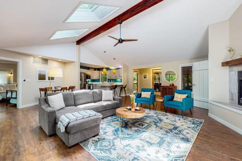 a living room with a couch and a table at The Tree House in New Buffalo