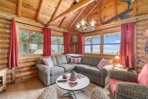 a living room with a couch and a table at Cedar Crest in Empire