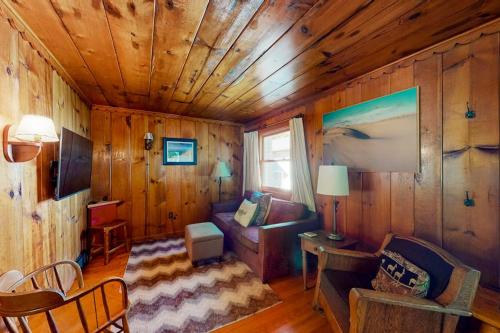 a living room with a couch and a table at Empire Lodge in Empire