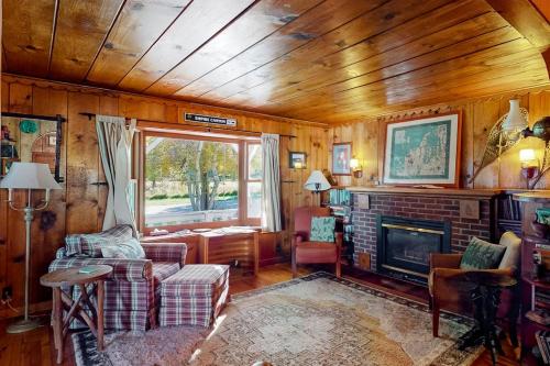 a living room with a couch and a fireplace at Empire Lodge in Empire
