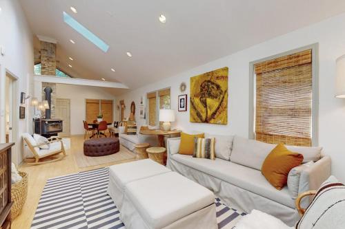 a living room with a couch and a table at Lilly Bell Villa in Three Oaks