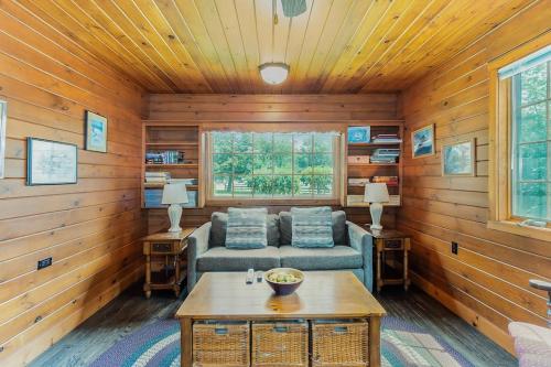 a living room with a couch and a table at Peterson Mill in Saugatuck